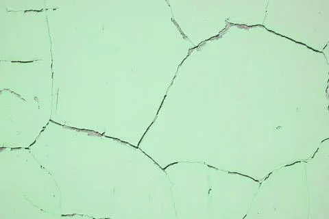 The surface of the old cracked wall is light green. With space to copy Stock-Fotos
