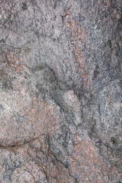 Surface of the old granite stone as a backdrop. Stock Photos