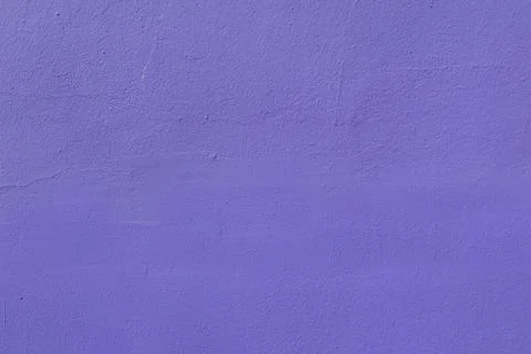 The surface of an old purple wall damaged by time. Stock Photos