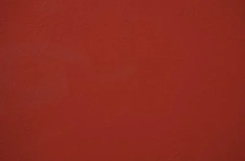 The surface of the old red wall damaged by time. Stock Photos