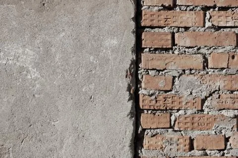 Surface of an old wall with cement plaster red brick grunge background textur Stock-Fotos