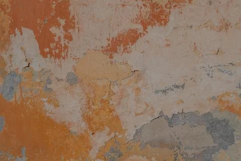 Surface of the old wall with exfoliating and falling off paint as a background Stock Photos
