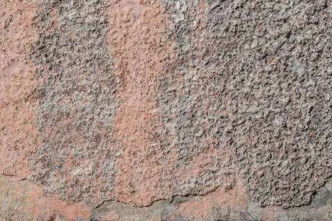 Surface of the old wall with exfoliating and falling off paint as a backdrop Stock Photos