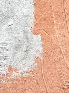 Surface of an old wall painted with gray paint over terracotta paint Stock Photos