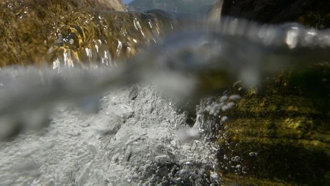 Surface out of Rapids Stream Underwater Bubbles Slowmotion River Maggia Stock Footage 114608631