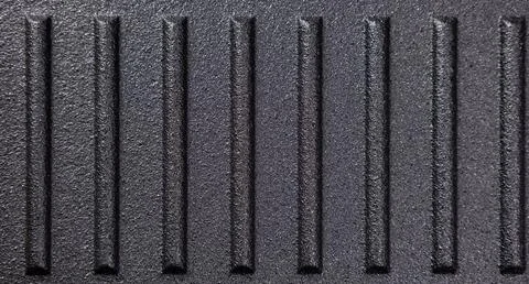 Surface with parallel grooves used for cooking on a stovetop in kitchen 库存照片