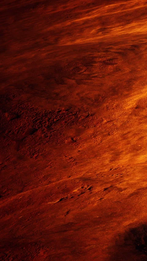 Surface of a planet showing orange and red colors under bright light Video stock 346877991