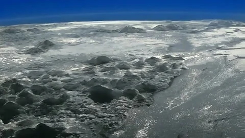 Surface of Pluto, Real NASA Footage, Colorized &amp; Enhanced, 4K Stock Footage 235908741