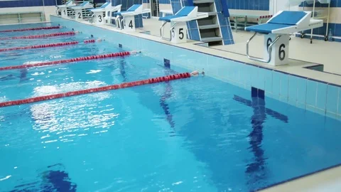 The Surface Of The Pool With Blue Water And Red Dividers Of Swimming Tracks. Stock Footage 109433003