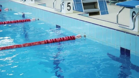 The Surface Of The Pool With Blue Water And Red Dividers Of Swimming Tracks. Stock Footage 109433034