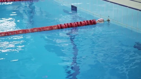 The Surface Of The Pool With Blue Water And Red Dividers Of Swimming Tracks. Stock Footage 109433087