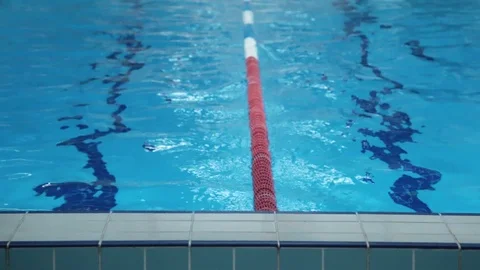 The Surface Of The Pool With Blue Water And Red Dividers Of Swimming Tracks. Stock Footage 109433115