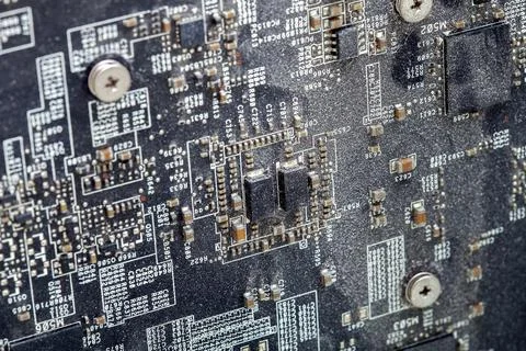 Surface of the printed circuit board with dirty chips. Stock Photos
