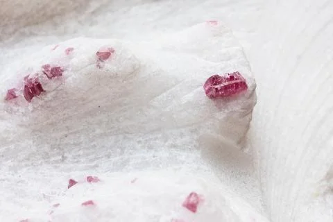Surface of quartz rock with ruby crystals close-up Stock Photos