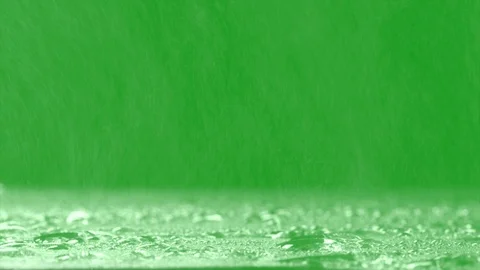 Surface Rainstorm on green background. Realistic rain and water droplets Stock Footage 104716625