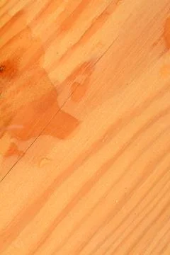 Surface of a rectangular wooden board with wavy lines and water. Stock Photos