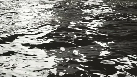 Surface ripple black water wave reflection light Stock Footage 152231313