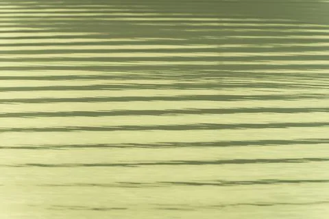 Surface ripples background of parallel lines of shade and light. Stock Photos