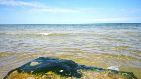 Surface of a rock on the beach, splash sea waves, baltic sea in Poland Stock Footage 203947852
