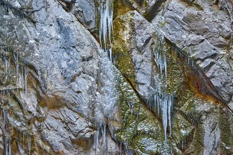 Surface of the rock with icicles Stock Photos