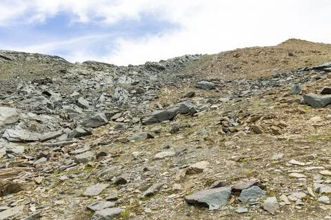 Surface of rocks with sedimented debris over time. Martian landscape. Stock Photos