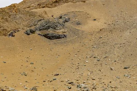 Surface of rocks with sedimented debris over time. Martian landscape. Фото