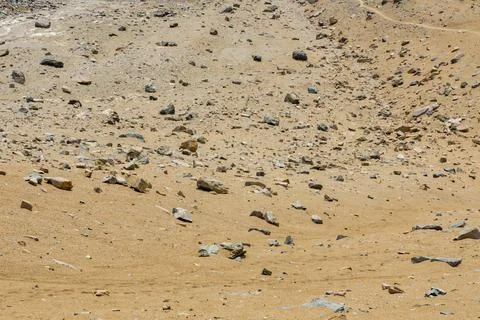Surface of rocks with sedimented debris over time. Martian landscape. Stock Photos