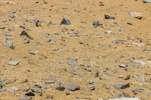 Surface of rocks with sedimented debris over time. Martian landscape. Stock Photos