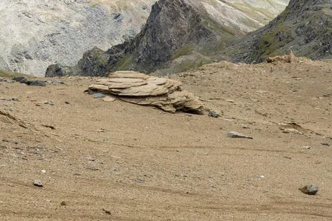 Surface of rocks with sedimented debris over time. Martian landscape. Stock Photos