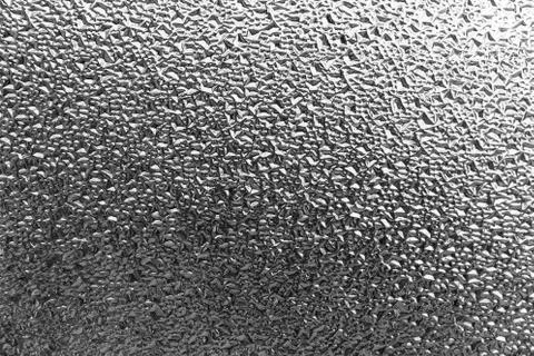 Surface of rough glass window touching light outside Stock Photos