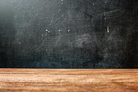 The surface of the rough wooden table top and school Board stained with chalk Stock-Fotos