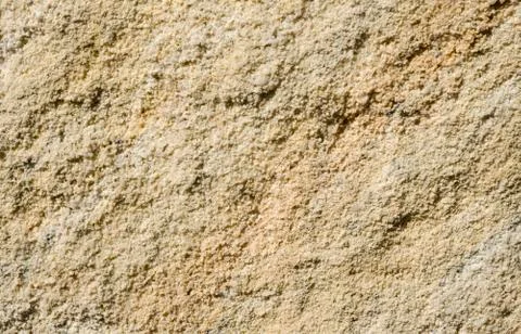 Surface of rough yellow sandstone Stock Photos