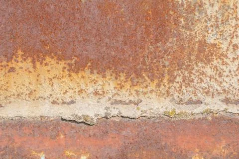 Surface of rusty iron with remnants of old paint texture background Stock Photos