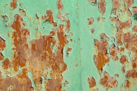Surface of rusty iron with remnants of old paint texture background Stock Photos