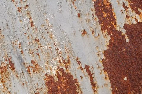 Surface of rusty iron with remnants of old paint, texture background Stock Photos