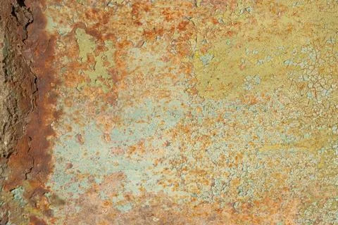 Surface of rusty iron with remnants of old paint, texture background Stock Photos