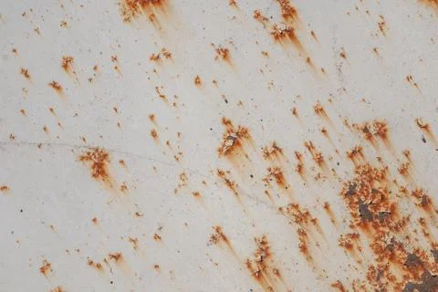 Surface of rusty iron with remnants of old paint, white texture, background Stock Photos