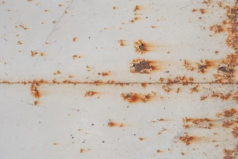 Surface of rusty iron with remnants of old paint, white texture, background Stock Photos