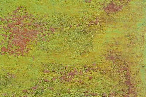 Surface of rusty iron with remnants of old paint, green texture, background Stock Photos