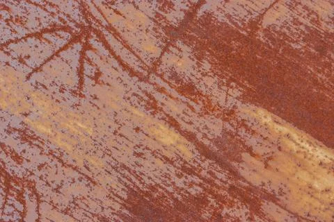 Surface of rusty iron with remnants of old paint, texture background Stock Photos