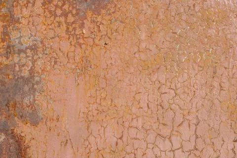 Surface of rusty iron with remnants of old paint, beige texture, background Stock Photos