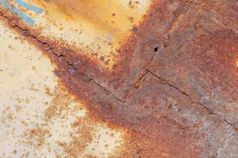 Surface of rusty iron with remnants of old paint, texture background Stock Photos