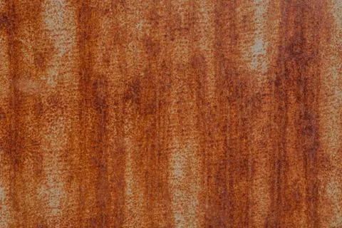 Surface of rusty iron with remnants of old paint, texture background Stock Photos