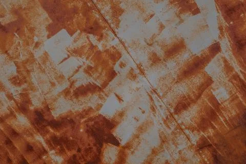 Surface of rusty iron with remnants of old paint, orange texture background Stock Photos