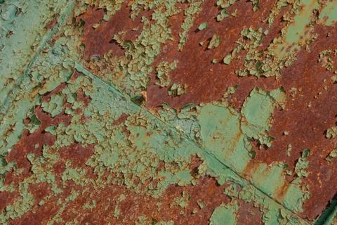 Surface of rusty iron with remnants of old paint, grunge metal surface, green Stock Photos