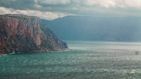 The surface of the sea with ripples from the waves, in the foreground a steep Stock Footage 220998739