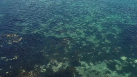 The surface of the sea through which the bottom is visible. Stock Footage 142661704