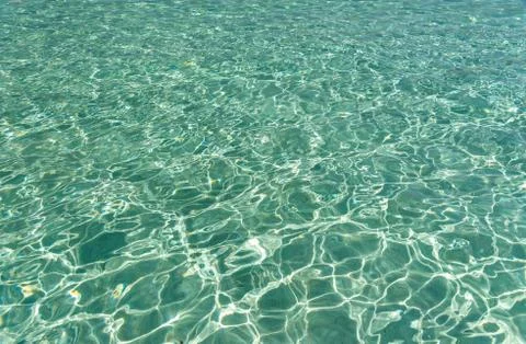 The surface of sea water under the rays of the hot sun. Stockfoto's