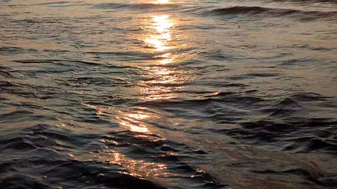 The surface of the sea waves with a sun path in the morning at sunrise Stock Footage 328294637