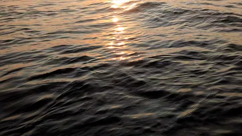 The surface of the sea waves with a sun path in the morning at sunrise Stock Footage 328294733